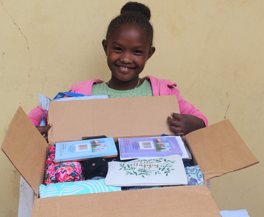 Child receiving a special gift package
